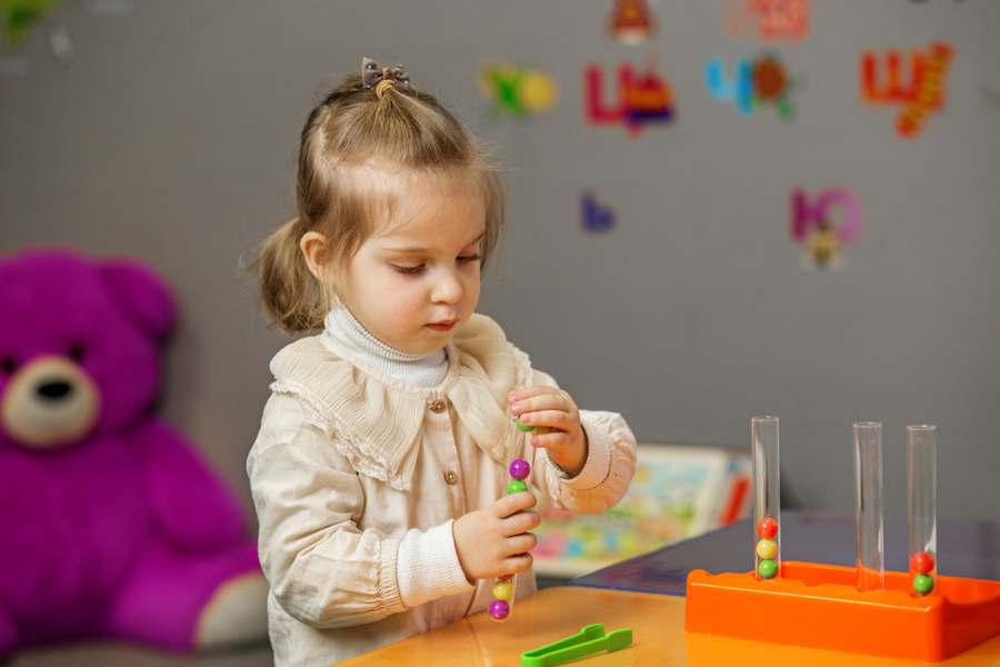 young-child-learning-with-educational-toy-at-home-2026-03-24-04-22-40-utc.jpg