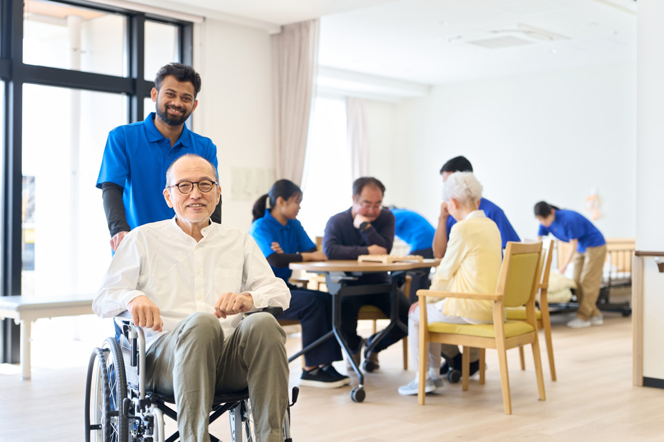senior-citizen-in-a-wheelchair-and-foreign-caregiv-2026-07-02-21-44-08-utc.jpg