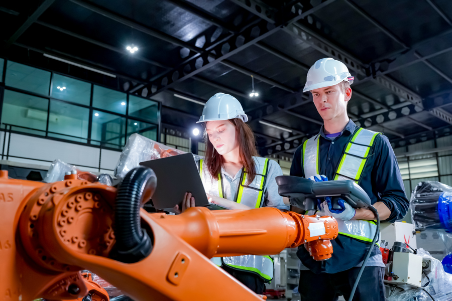 engineers-inspecting-robotic-arm-in-modern-factory-2026-01-07-07-08-52-utc.jpg