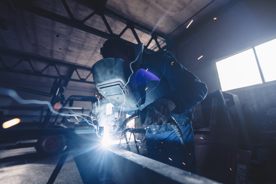 welder-working-in-industrial-factory-with-bright-s-2026-03-25-01-19-45-utc.jpg