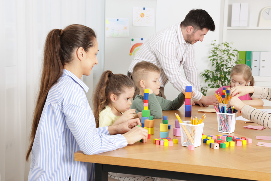 children-and-adults-playing-with-colorful-wooden-b-2026-03-27-01-47-37-utc.jpg
